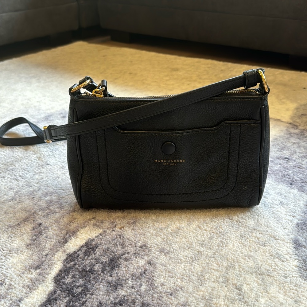 Used Marc Jacob leather crossbody with snap front closure and zipper